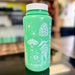 Load image into Gallery viewer, A glow in the dark water bottle with white ink and plants and flowers design
