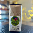 Load image into Gallery viewer, Bag of dark roast coffee, the label has a heart with the word Estes within it, and the words "giving guest blend" with elk antlers around it