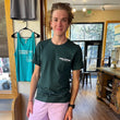 Load image into Gallery viewer, Man wearing a dark green t-shirt that says "Kind Coffee Estes Park, Colorado" on the front lapel