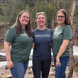 Load image into Gallery viewer, three women posing in shirts that say "kind coffee" across the chest