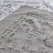 Load image into Gallery viewer, Closeup of gray bandana showing animal designs