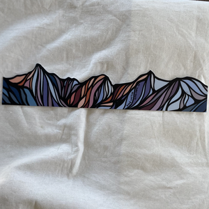 Long sticker of colorful abstract mountains.