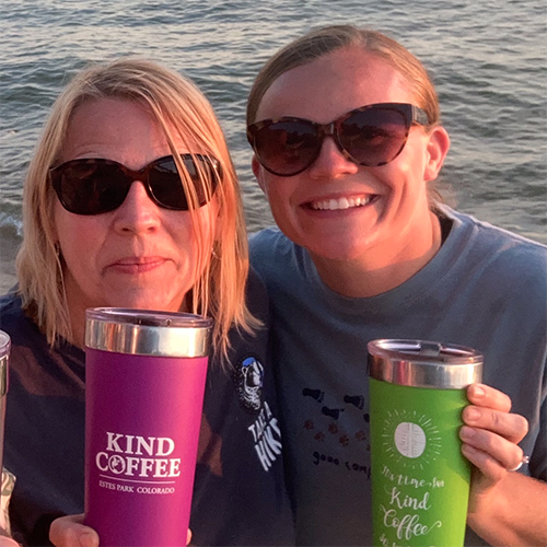 two women on the water with their kind coffee cups