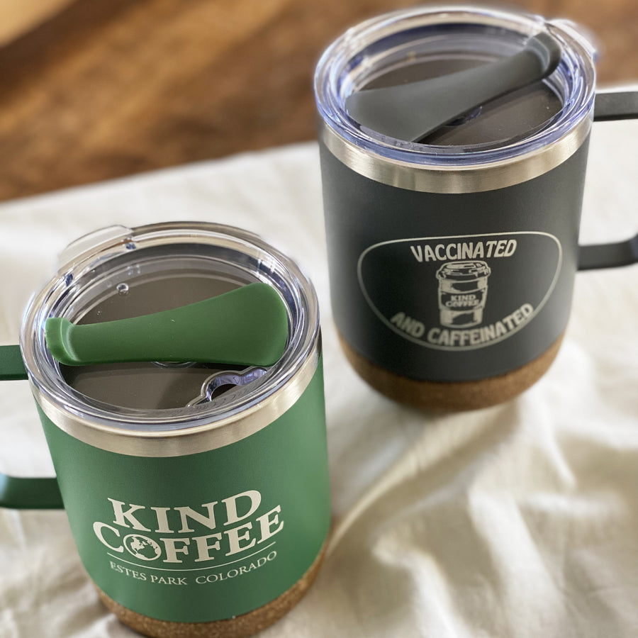 Green and black travel mugs