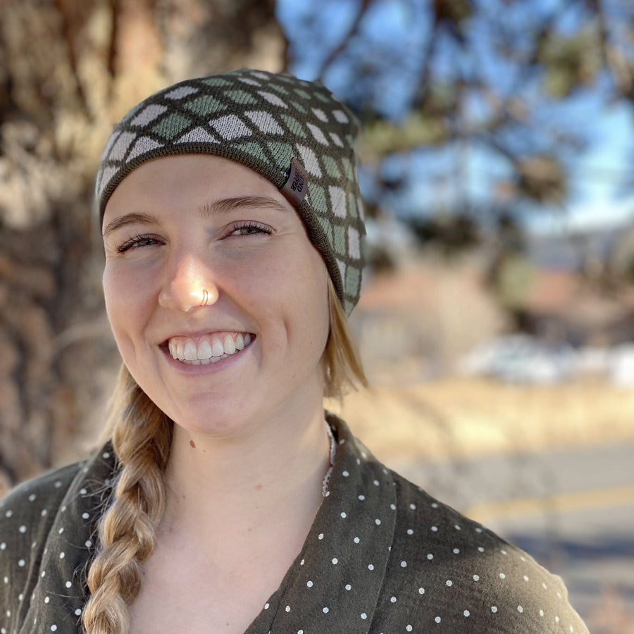 Woman wearing Kind coffee knit beanie