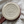 Load image into Gallery viewer, Un-glazed bottom of ceramic mug that reads &quot;JJ Potts American - Handmade&quot; with an etched mountain scene
