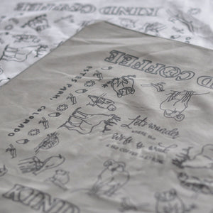 Closeup of gray bandana showing animal designs 