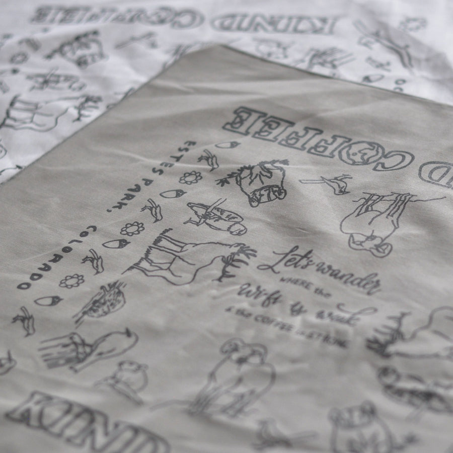 Closeup of gray bandana showing animal designs 