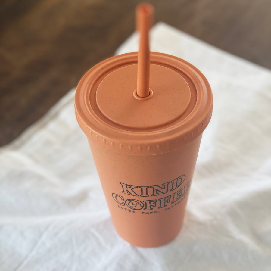 orange reusable kind coffee cup with lid and straw