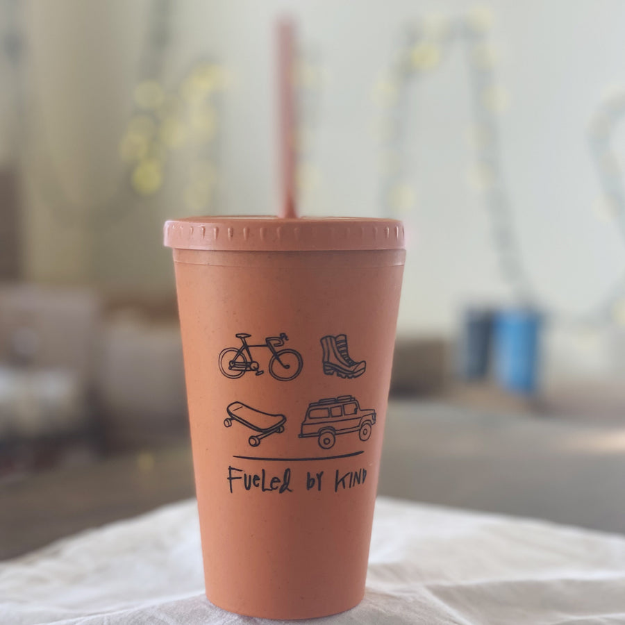 orange reusable kind coffee cup with straw
